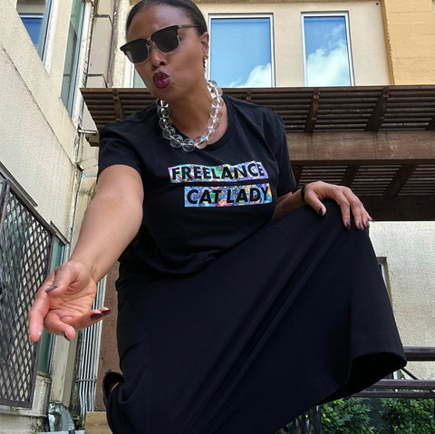Alexandria Boddie wearing black crop top that says “Freelance Cat Lady” in size large from The Iris Collection by Alexandria Boddie and Liz Tran.