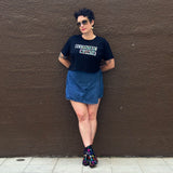 Liz Tran wearing a black crop top with 'Eccentric Auntie' text in size large from The Iris Collection by Alexandria Boddie and Liz Tran.